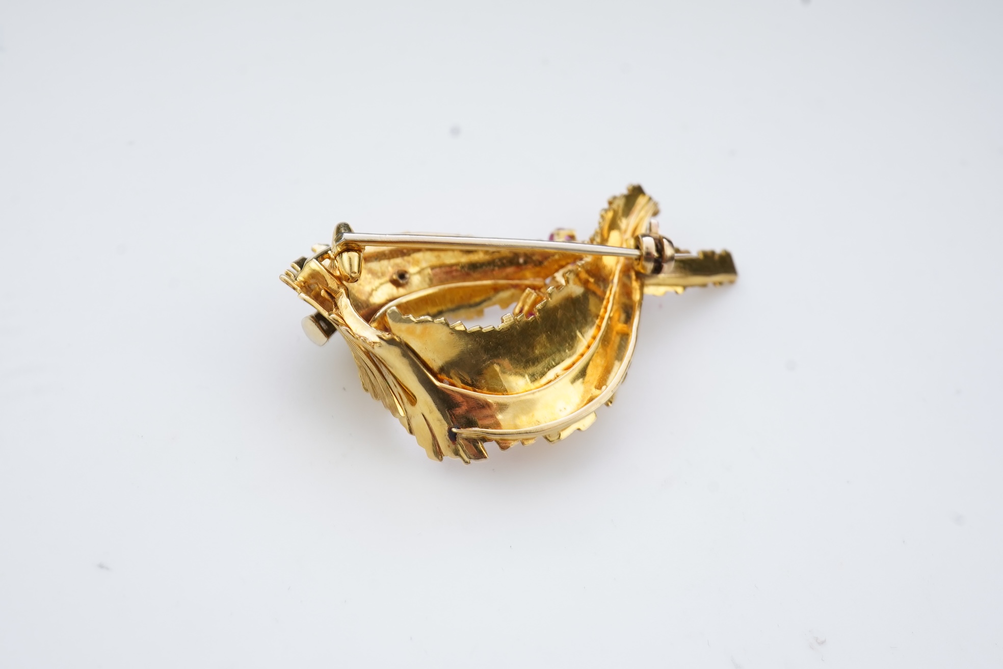 A gold, ruby and diamond brooch, circa 1965
